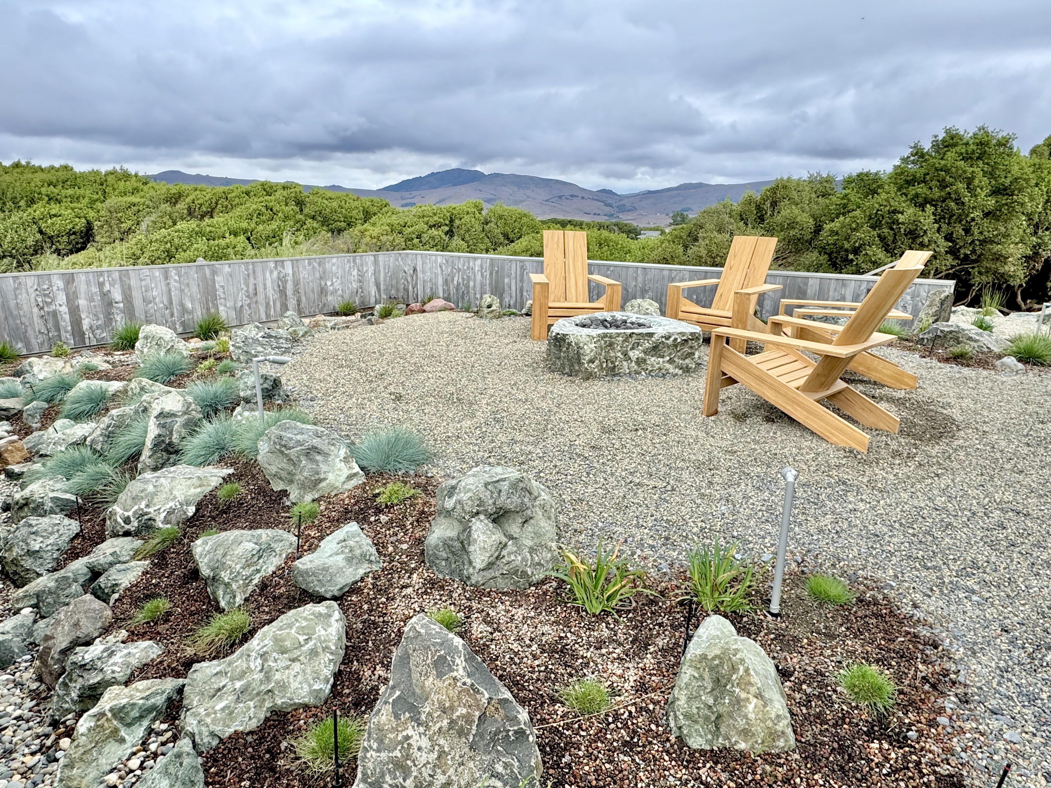 Roofscape with fire pit gathering area and terraformed mound; rock gardens & dry creek features